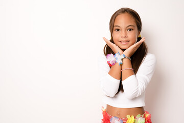 little child girl in hawaiian costume standing isolated white background