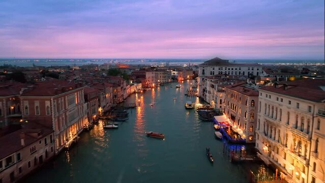 4K aerial drone view of Venice grand canal cathedral church in old town birds view. Venice italy skyline at sunset colored sky. Italy