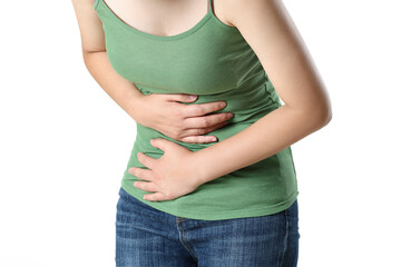 young woman suffering from stomach pain,close-up. food poisoning,cramps, isolated
