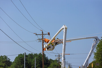 Electrician worker electric power pole maintenance industry to repair the damaged power line...