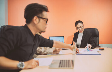 business muslim and asian woman and man have meeting. adult worker present showing benefit for company. international convention room with group of diversity people having a conversation in workplace