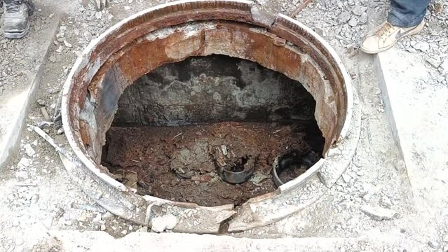 open lid sewer pipe repair on the road