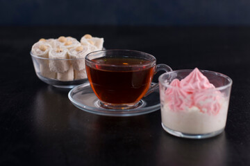 A cup of tea with turkish lokum and marshmallows