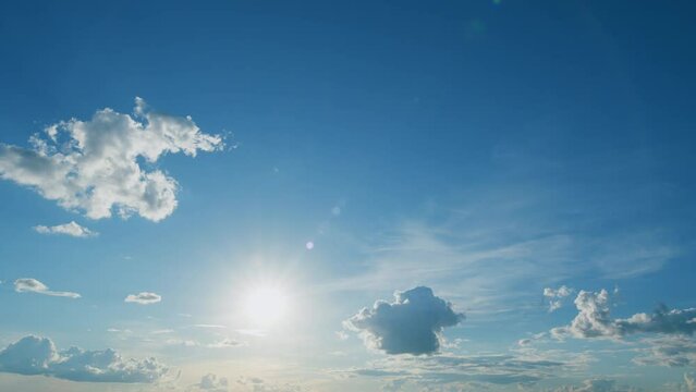 Bright shining rays sun rising above clouds. Sunset sky cloud background. Timelapse.