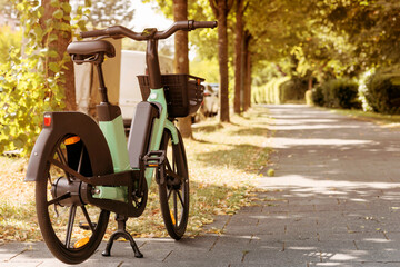 Bike Rent e-bicycle in Street Park. Electric Bicycle sharing Service. Electric bike in urban Space...