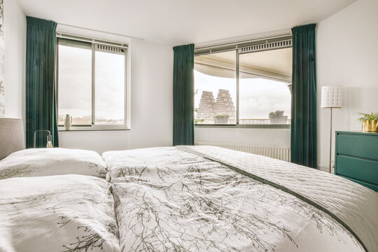 Spacious bedroom with bed and cabinet in house