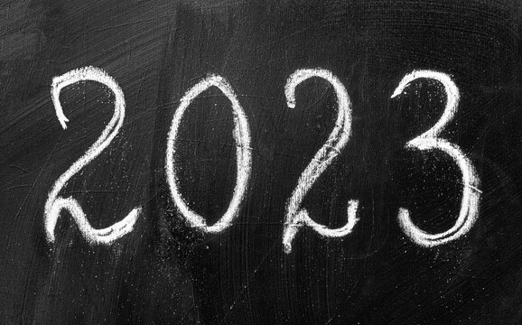 The inscription 2023 in chalk on a school blackboard.