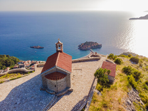 The Church of St. Sava in Montenegro, near the island of Sveti Stefan near Budwa. Drone view. Location: church St. Sava, Montenegro, Balkans, Adriatic sea, Europe Portrait of a disgruntled girl