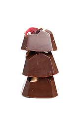 Handmade bonbon with berry and nuts filling isolated on white background. Exclusive handcrafted candies. Vertical photo