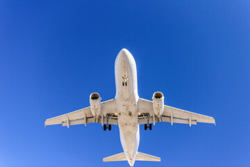Fototapeta na wymiar Airplane landing close up low angle