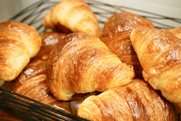 many fresh baked croissants in a box 