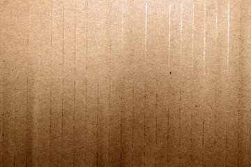 Old brown paper texture with streaks close-up
