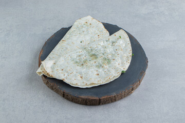 Freshly baked gutabs on the board , on the marble background
