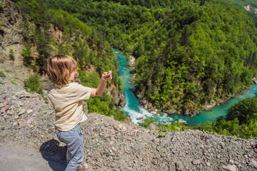 Boy on the background River bend, Montenegro,.natural landscape, mountain river Tara