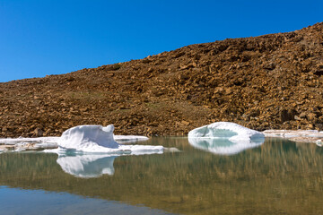 Ice from the glacier floats in the lake. Polar Urals, Russia.