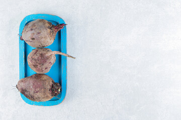 Flavorful beetroot in the bowl , on the marble background