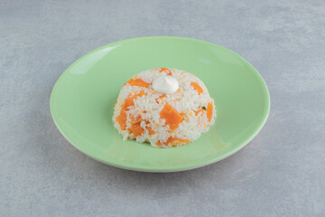 Mayonnaise on the rice in the plate , on the marble background