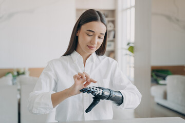 Young disabled girl turns on her bionic prosthetic arm, training to use artificial robotic hand