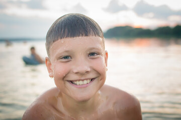 Rest on vacation. Bathing. Child at Lake Myastro