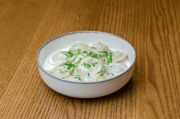 dumplings in sour cream in a plate