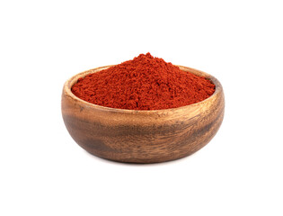 Wooden bowl full of smoked paprika on a white background.