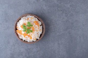 Vegetarian rice in the bowl , on the marble background