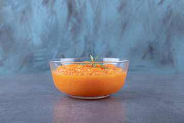 A bowl of lentil soup, on the marble background