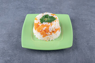 A small portion carrot rice , on the marble background