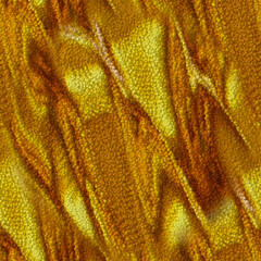 Beautiful golden seamless abstraction with uneven lines. A texture consisting of small bubbles of yellow and brown shades. Crumpled golden fabric.
