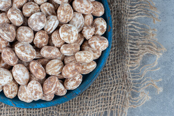 A bowl of confectionery on the marble background