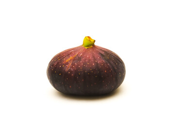 Dark figs on a white background. Shallow depth of field