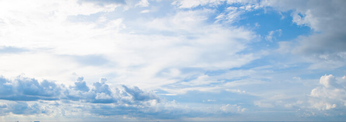 Naklejka na ściany i meble Blue sky and beautiful clouds. Wide photo.