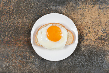 Plate of tasty toast with egg for breakfast