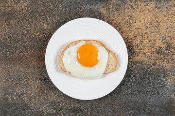 Plate of tasty toast with egg for breakfast