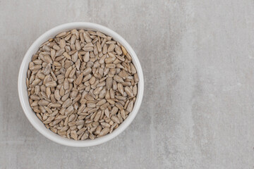 Roasted sunflower seeds in white bowl