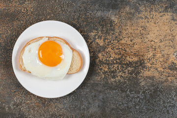 Plate of tasty toast with egg for breakfast