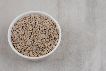 Roasted sunflower seeds in white bowl