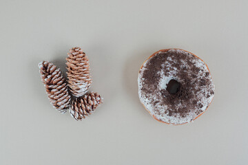 Chocolate doughnut with Christmas pinecones