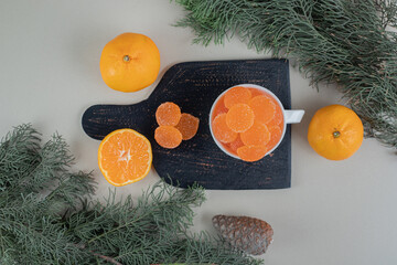 Pair of fresh oranges with sugary marmalades