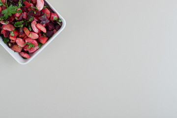 A white plate full of delicious vinaigrette