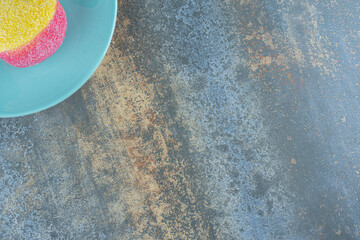 Star anise and cookie in the form of peaches on the plate, on the marble background