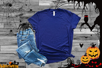 Obraz premium Mockup of a halloween Heather Midnight navy T-Shirt Blank Shirt Template Photo with Fall accessories and wooden background halloween shirt mockup 