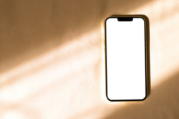 Phone mockup with sunlight shadows on beige background

