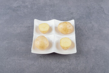 Boiled delicious potatoes in white plate