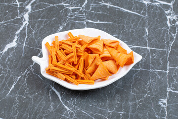 Variety of salted crackers on leaf shaped plate
