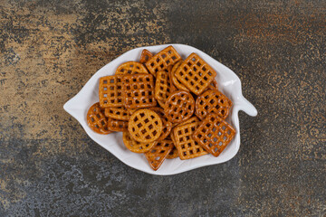 Variety of salted crackers on leaf shaped plate