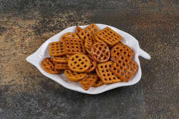 Variety of salted crackers on leaf shaped plate