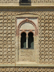 Detail of facade with Mudejar bifora window and traditional sgraffito geometric decoration.
Alcazar of Segovia. Spain.