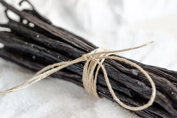 A bunch of vanilla pods tied with string