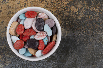 Oval shaped stone candies in white bowl